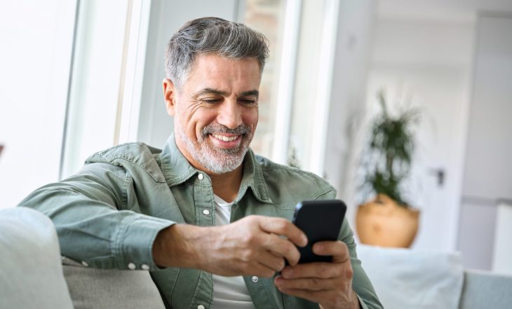 Smiling,Happy,Senior,Mature,Middle,Aged,Man,Holding,Cell,Mobile